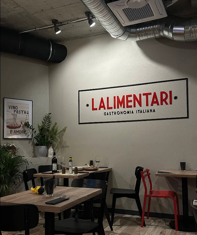 Deli and grocery shelves at L'Alimentari